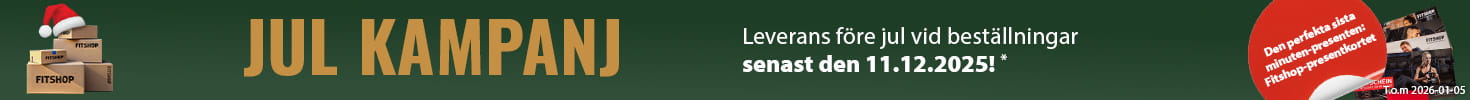 En julig reklambanner med grön bakgrund och en ljusslinga längst upp på bilden. Till vänster ligger flera paket med texten ”Fitshop”. Bredvid dem finns flera presentkort från Fitshop. I ett rött textfält står det ”Den perfekta sista minuten-presenten: presentkortet från Fitshop”. På höger sida står det med versaler ”Christmas Sale” samt tillägget ”Leverans före jul vid beställningar före den 16 december 2025!”.11.12.2025